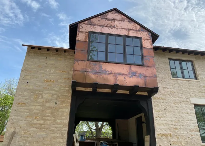 Copper metal panel facade on a stone building for Skylight Installation in Westerville