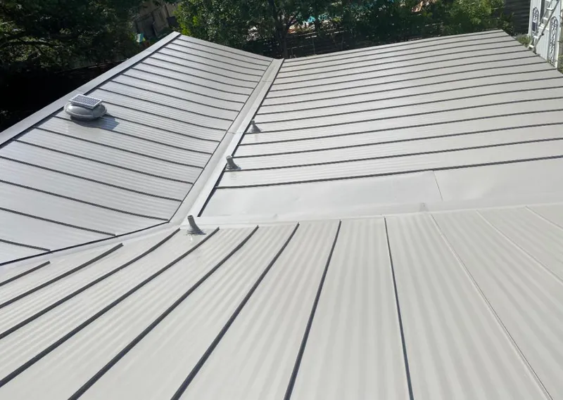 Solar attic fan installed on a metal roof for Roof Ventilation in Westerville